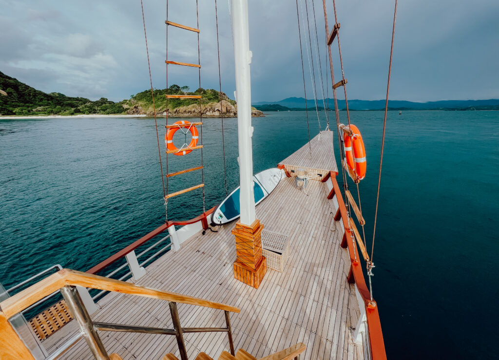 View from the deck of the Gandiva phinisi sailing in Komodo National Park waters