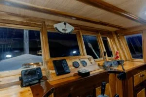 The sleek wooden interior of a phinisi boat in Labuan Bajo. — Barakati Phinisi Adventure in Komodo