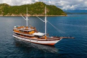 The Refviero phinisi anchored near stunning islands in Komodo. — Refviero Phinisi Komodo Sailing Tour